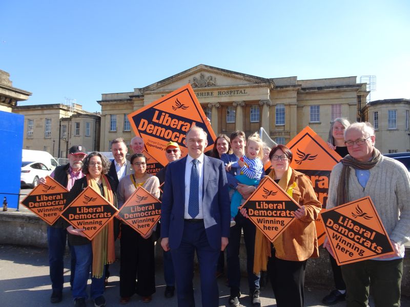 Photo is of Lib Dem Leader Ed Davey and Reading Lib Dems outside the RBH.